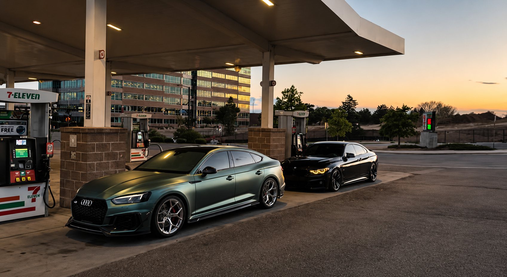 Matte green Audi RS5 alongside a black BMW at dusk